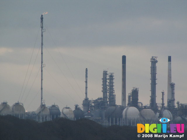 SX01126 Oil refinery with flame from chimney Milford Haven